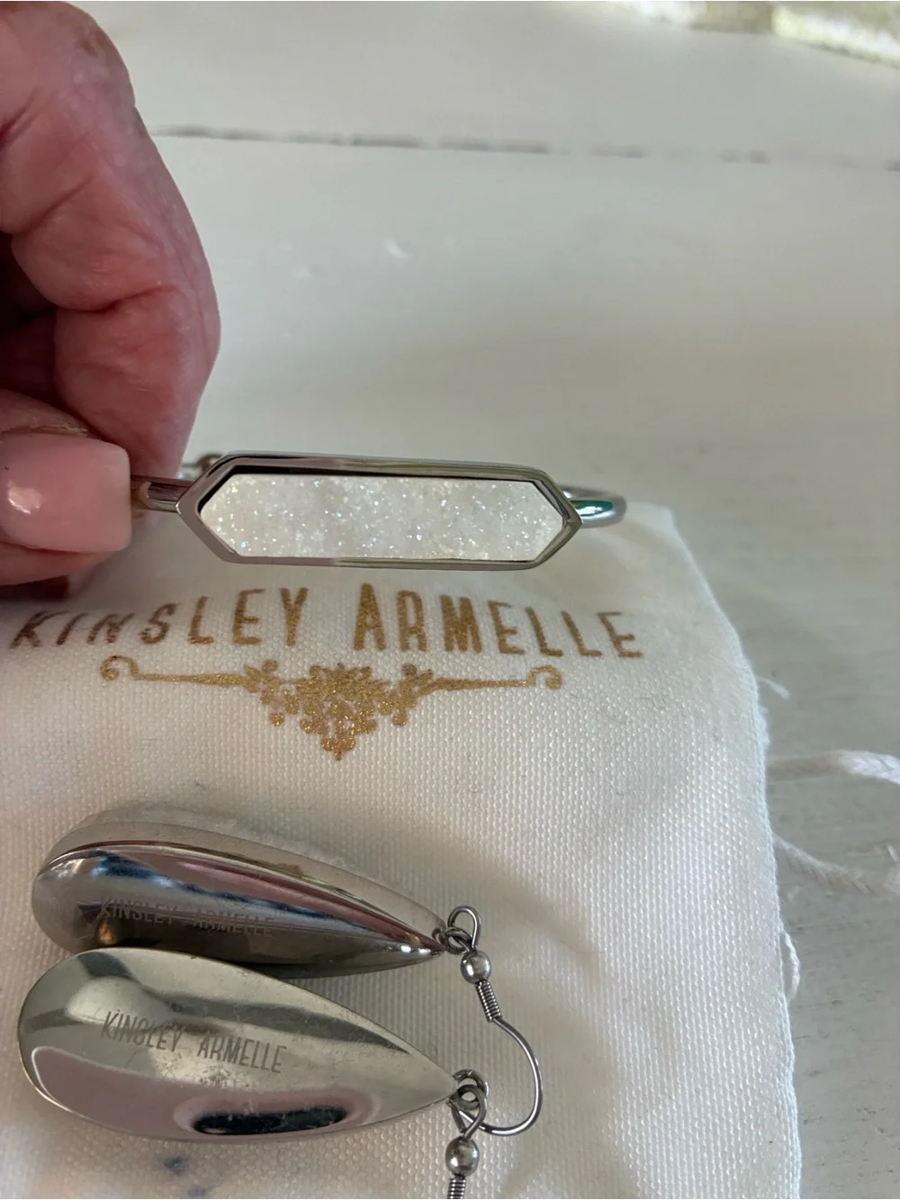 Kinsley Armelle White Druzy Teardrop Earrings and matching silver tone bracelet